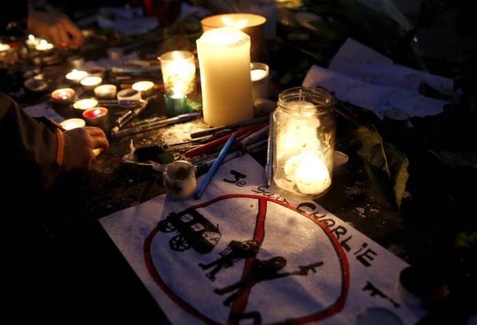 עצרת לזכר ההרוגים בפיגועים בצרפת (צילום:  רויטרס)