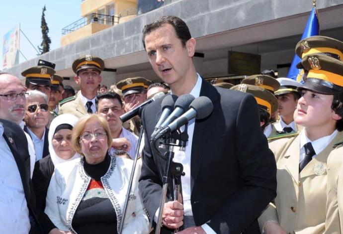 נשיא סוריה בשאר אסד ותומכיו (צילום:  רויטרס)
