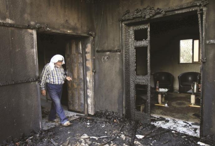 בית משפחת דוואבשה לאחר הפיגוע (צילום:  רויטרס)