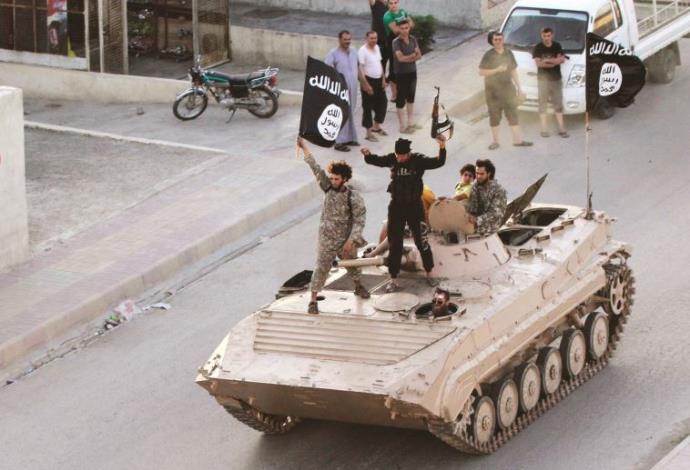 אנשי דאעש בסוריה (צילום:  רויטרס)