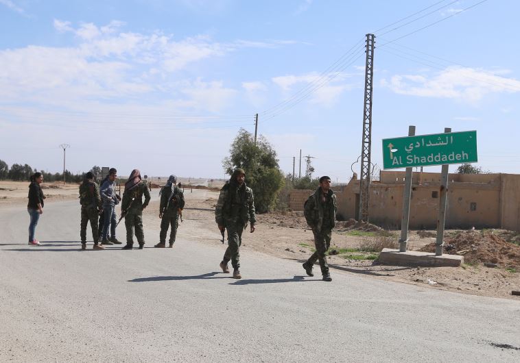 כוחות אופוזיציה נכנס לעיירה אל שדאדי. צילום: רויטרס