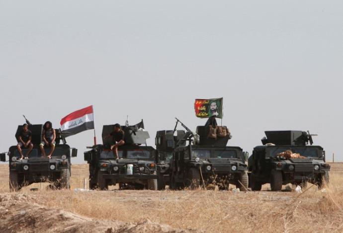 כוחות עיראקיים מתקדמים לעבר מוסול (צילום:  רויטרס)